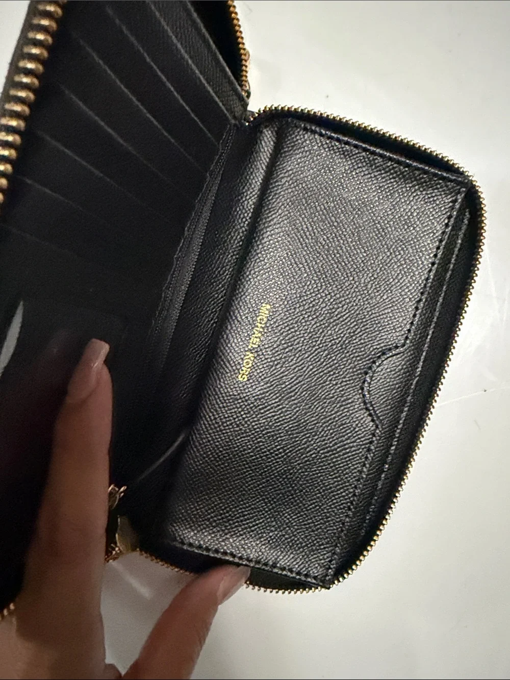 Michael Kors Black Wristlet with Gold Stud Pattern